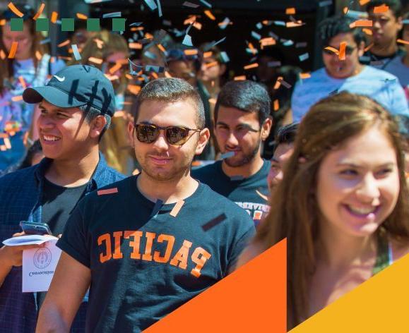 Student wearing a Pacific shirt with confetti overhead